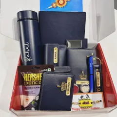This Rakhi hamper is a perfect example of a complete gift solution. It includes a personalized flask, wallet, keychain, and other accessories, all coordinated in a stylish navy blue theme for a thoughtful and impressive present.