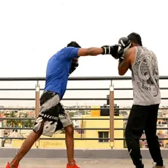 Practicing a midrange boxing drill on the rooftop. Here, we are working on landing a clean cross while maintaining proper distance and guard. How you practice is how you will fight.