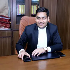 At my desk, ready for the day's work at Saket Court. My office is equipped to handle all aspects of your case, from initial filing to final arguments.