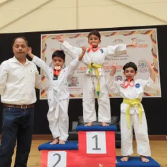 The joy of achievement is a powerful motivator. Here, our young students celebrate their victories at the New Delhi District Taekwondo Championship. We don't just teach techniques; we build the confidence to compete and the resilience to win.