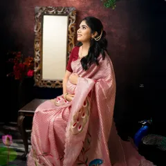 Looking towards the future with a gentle smile. The setup with the ornate mirror and peacock details adds a touch of royalty to this traditional maternity portrait.