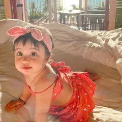 My daughter Aarriya, the heart and soul of the atelier, in a custom heart-print crop top and skirt set. This adorable backless design is perfect for warm, sunny days.