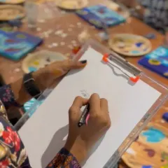 A close up of me in action at a Third Wave Coffee event. All I need is my clipboard, paper, and pencils to start the fun.