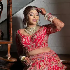 A moment of quiet reflection before the ceremony. The makeup is designed to be picture-perfect from every angle, with a focus on smooth skin and beautifully blended tones that catch the light.