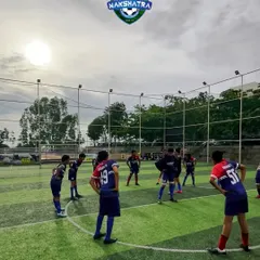 Every stretch counts. Our young athletes getting ready to give their all during a training session, focusing on flexibility and injury prevention.