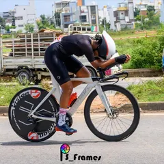 An action shot of one of our women racers in full aerodynamic tuck during a State Championship Individual Time Trial (ITT). This photo showcases the focus and power required for competitive racing.