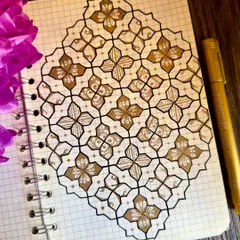 A simple yet elegant pattern in gold and black. Using a grid book helps me maintain the precision of these geometric designs, while the touch of gold adds a little bit of sparkle.