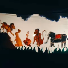 A full scene from our Chitrakathi show, featuring a lineup of handcrafted leather puppets. Each character, from the lion to the monkey, is intricately detailed, showcasing the incredible artistry of this folk tradition.