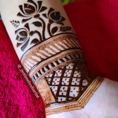 Mastering techniques like cutwork is essential for a professional artist. In my classes, you will learn how to create this beautiful negative space effect, shown here with a clean lotus cuff design on the wrist.