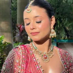 An eyes-closed shot to highlight the soft, blended eyeshadow and flawless base.