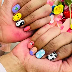 This is the kind of creative, hand-painted nail art you can learn to create. My course covers a wide range of fun and trendy designs, from characters and symbols to abstract patterns.