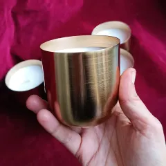 I also work with metal containers, like these beautiful brass jar candles. The warm metallic finish adds a touch of timeless elegance.