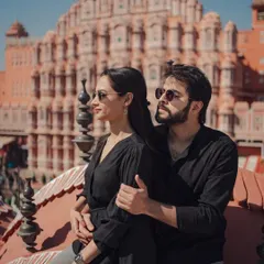 A modern, stylish couple portrait with the iconic Hawa Mahal as the backdrop. We love finding unique angles that blend contemporary style with the timeless beauty of Jaipur's architecture for a truly memorable pre-wedding shoot.