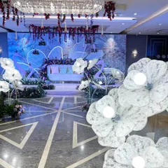 The full view of our 'Illuminated Garden' stage, with glowing floral props lining the aisle, creating a magical pathway.