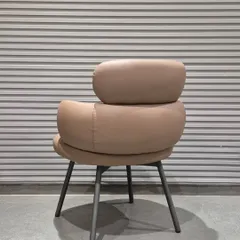 The back view of the new multipurpose chair, showing how the cushions are separated to create a light, airy look.