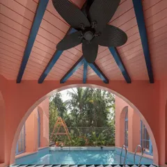 An arch frames a view, creating a deliberate moment of focus. Here at Baia Villas, the archway over the pool frames the lush tropical landscape, creating a living painting and a tranquil space for reflection.