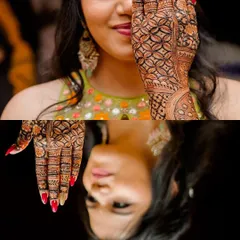 An artistic shot of the bride, highlighting the intricate mehendi design on the back of her hand, perfectly complemented by her red nails.