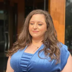 Another portrait of the client, showcasing the subtle and elegant makeup that is perfect for wedding guests of any age.