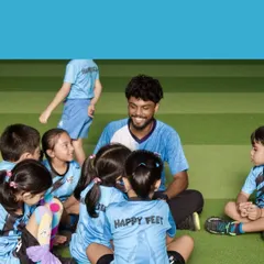 Story time on the field. I use these moments to connect with the kids, explain the next game, and make sure everyone is ready for more fun.