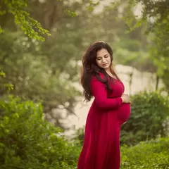 A moody and soulful portrait taken during the monsoon season. The diffused light and deep red gown create a rich, dramatic look that I absolutely love for capturing raw emotion.