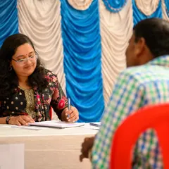 A moment from our free health camp, showing a one-on-one consultation. Taking the time to listen to each person's health concerns is a vital part of my community service.