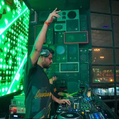 In the zone at Bombay Adda, Bengaluru. With the VDJ screen lighting up behind me and a wall of speakers ready to go, I'm focused on delivering a high-impact Bollywood bass set.