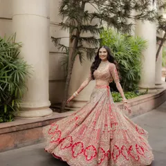 A radiant bride in her element. This joyful twirl showcases the intricate details of her Ejaaz Couture lehenga and her infectious happiness. We love capturing these uninhibited moments of bridal bliss.
