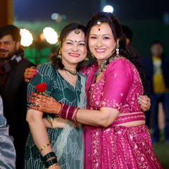A heartfelt hug between two family members, their smiles lighting up the frame. Capturing these bonds is a key part of my family function photography.