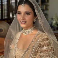 For this bride's Anand Karaj ceremony, we chose a soft, ethereal makeup look. The focus was on fresh, glowing skin and subtly defined eyes, perfectly matching the delicate pastel tones of her Tarun Tahiliani outfit. This is an example of minimal magic, enhancing natural beauty.