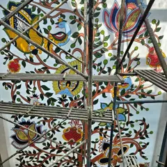 A view from the top of the scaffolding, looking down at the intricate branches of the Kalamkari Tree of Life. The scale of this residential mural was immense, and so was the joy in creating it.