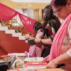 Teachers and parents browsing our curated selection. We bring a wide range of books to our school fairs, ensuring there's something for every age and interest.