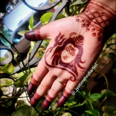 A close-up of the Lord Shiva portrait design, showing the detail in his expression and the trishul. This is a powerful design for devotees.