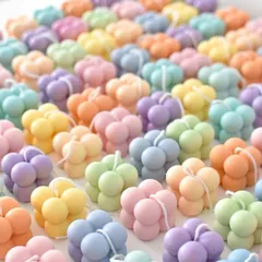 An army of colorful mini bubble candles, ready to bring a pop of color and fun to any party.