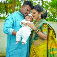 The look of love. This candid moment between a mother, father, and their newborn is what family photography is all about.