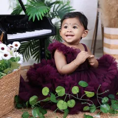 A bright, happy smile from the birthday girl! We focus on capturing genuine expressions of joy during our milestone photoshoots.