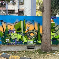 A straight-on shot of my Stylebound mural. This piece is full of mechanical details, like pipes and wires, and features my signature "DEXTER" tag integrated into the design.