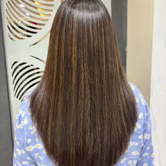 The view from the back shows how beautifully the highlights are distributed through the hair. The Botox treatment provides a perfect, sleek canvas that makes the color pop.