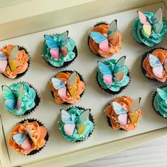 For a more elegant celebration, I create designs like these chocolate mini cupcakes with delicate edible butterflies. The combination of soft peach and baby blue buttercream frosting, dotted with sugar pearls, is perfect for baby showers, birthdays, or sophisticated tea parties.