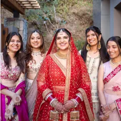 The bride surrounded by her tribe. The genuine smiles and laughter in this photo are what it's all about: celebrating with the people who matter most.