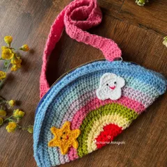 Our handmade rainbow-shaped mini crochet bag is perfect for little ones to carry their treasures. It's lightweight, colorful, and has a secure zipper.