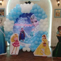 The full view of our 'Frozen' and Princess theme setup. We combined Elsa with other popular princesses like Barbie and Belle, complete with life-sized cutouts and a stunning balloon photo booth.