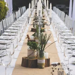 A rustic and elegant long table setup from one of our earlier weddings. This image is part of our 10-year story, showcasing our love for creating beautiful, communal dining experiences.