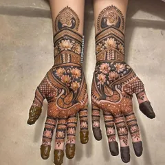 This design is a celebration of nature's beauty, with elegant peacocks and blooming lotuses. The use of negative space makes the motifs stand out beautifully.
