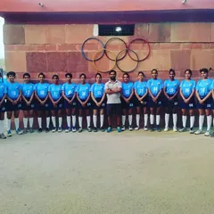 My Junior Women's team posing in front of the Olympic rings after securing their spot in the semi-finals. Their joy and confidence reflect a successful tournament run built on teamwork.