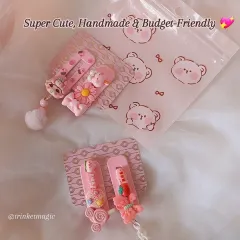 Super cute, handmade, and budget-friendly. This image shows two pairs of my pink hair clips, packaged and ready to go.