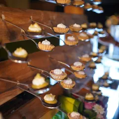 Our miniature fruit tarts are a perfect bite of sweetness. Each tart is individually placed on a tasting spoon for elegant, easy enjoyment, showcasing our attention to detail in both flavour and presentation.