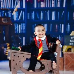 A happy smile from our little wizard, who is clearly enjoying his magical school day.
