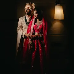 A dramatic, low-light portrait of the couple. We use creative lighting to create moody and cinematic images that feel like a movie still.