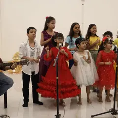 The Primary School Choir, our youngest group of performers, steals the show with their adorable and heartfelt performance. Their colorful dresses and joyful singing light up the stage.