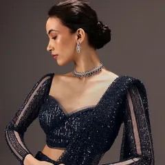 This is a perfect example of the soft glam I create for commercial bridal and occasion wear. The look features a clean, elegant updo and defined yet natural makeup, ensuring the focus remains on the intricate designer blouse.